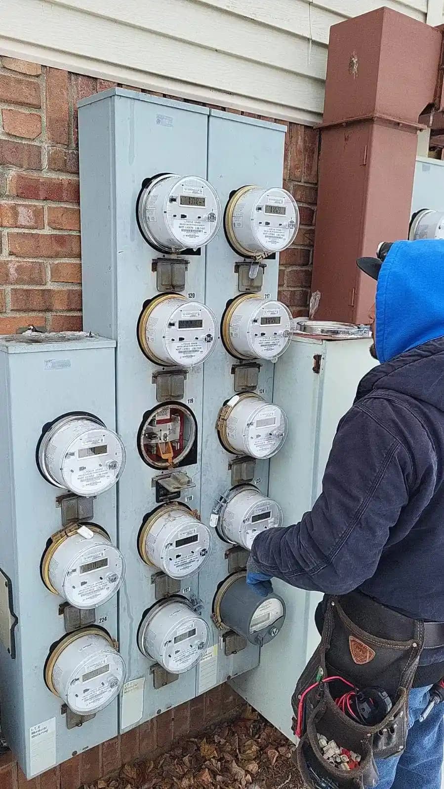 Electrician working on meters