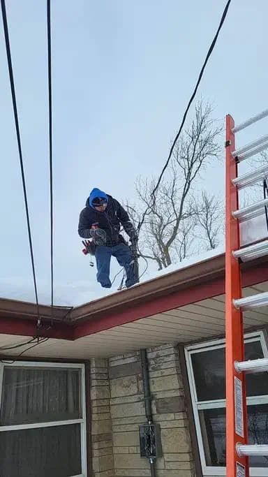 Electrician working on a roof